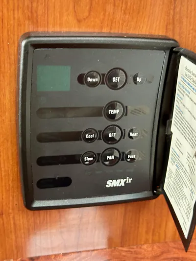 Aztec Princess Yacht Photos Pics Control panel on a 2006 Sea Ray 44 Sundancer boat, featuring temperature and fan settings.