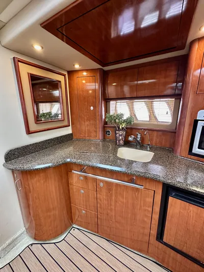 Aztec Princess Yacht Photos Pics Luxurious 2006 Sea Ray 44 Sundancer yacht interior with elegant wood cabinetry and modern amenities.