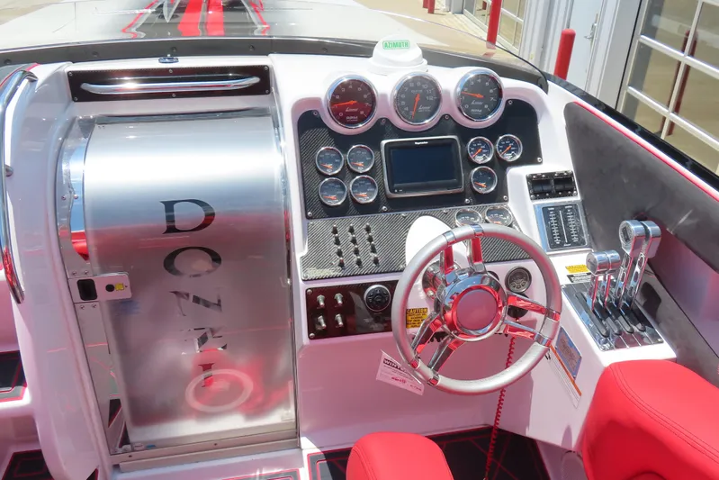  Yacht Photos Pics 2009 Donzi 35ZR boat dashboard with gauges, steering wheel, and controls.