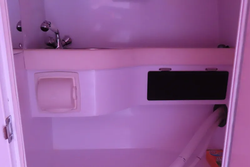  Yacht Photos Pics Interior of 2009 Donzi 35ZR boat showing compact bathroom sink and fixtures.