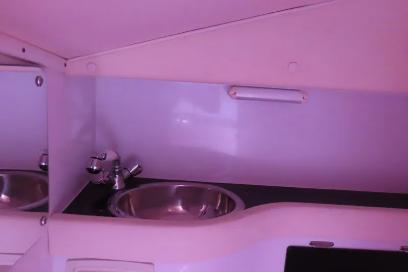  Yacht Photos Pics 2009 Donzi 35ZR interior sink with modern faucet and sleek design.