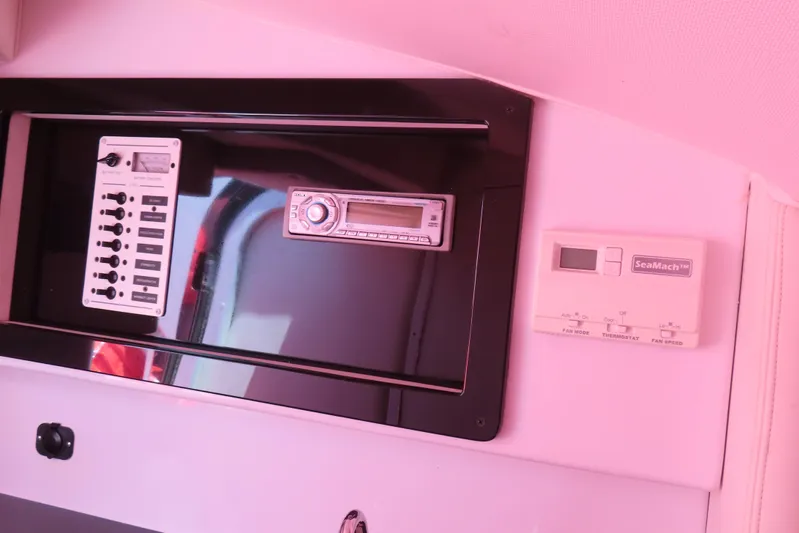  Yacht Photos Pics Control panel and stereo system inside a 2009 Donzi 35ZR boat cabin.
