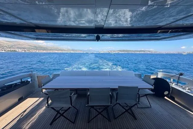  Yacht Photos Pics Luxurious 2019 Riva 100' Corsaro yacht with ocean view and elegant deck seating.