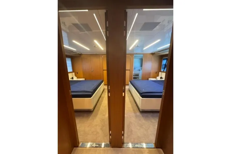  Yacht Photos Pics Luxurious bedroom interior of 2019 Riva 100' Corsaro yacht with modern design.