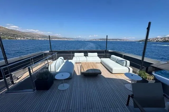  Yacht Photos Pics Luxurious deck of 2019 Riva 100' Corsaro yacht with elegant seating and ocean view.