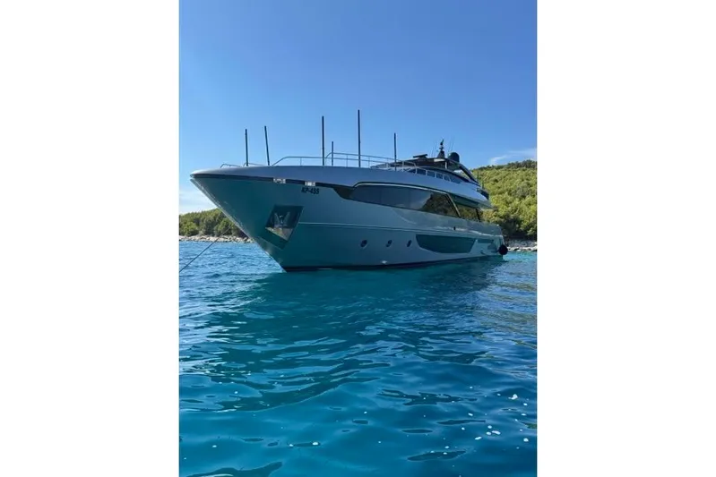  Yacht Photos Pics Luxury 2019 Riva 100' Corsaro yacht on clear blue water.