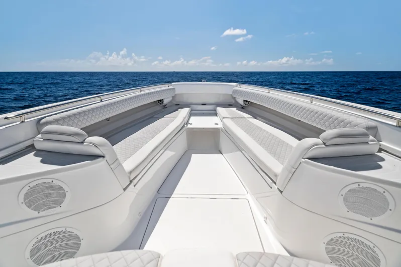 Strong III Yacht Photos Pics 2022 HCB Suenos boat interior with luxurious seating, set against a serene ocean backdrop.