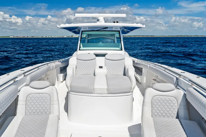 Strong III Yacht Photos Pics 2022 HCB Suenos boat with luxurious seating on open water under a clear sky.