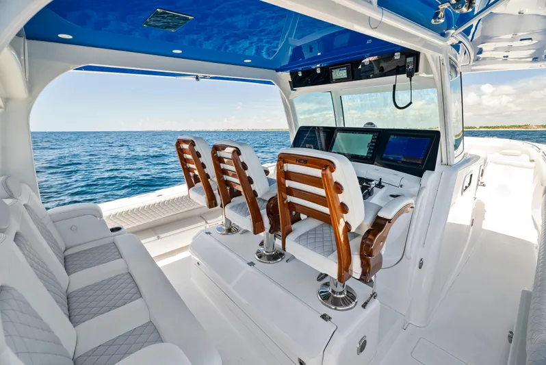 Strong III Yacht Photos Pics 2022 HCB Suenos boat interior with luxurious seating and advanced navigation system on open water.