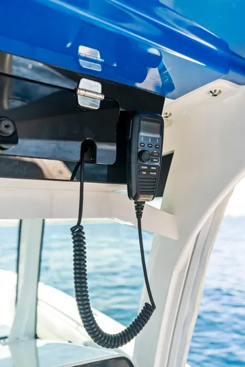 Strong III Yacht Photos Pics 2022 HCB Suenos boat communication device under blue canopy, ocean in background.