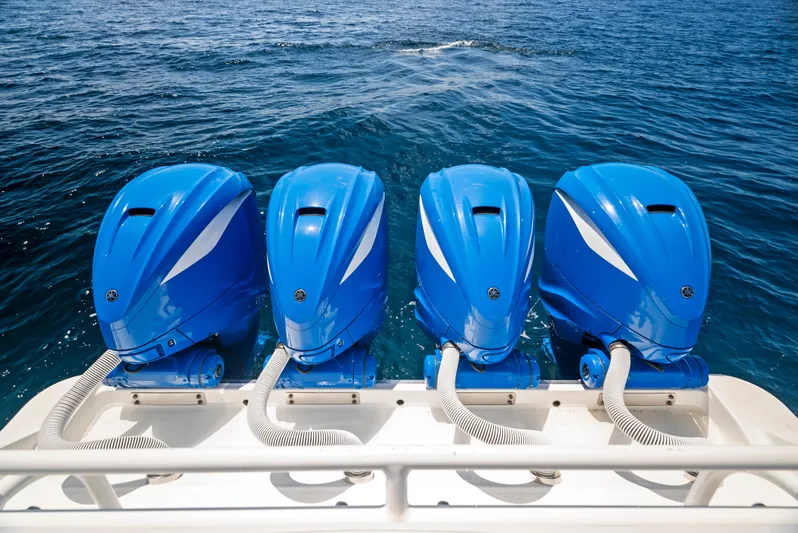 Strong III Yacht Photos Pics Four blue outboard motors on a 2022 HCB Suenos boat.