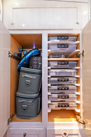 Strong III Yacht Photos Pics Storage cabinet with organized containers and bags on a 2022 HCB Suenos boat.