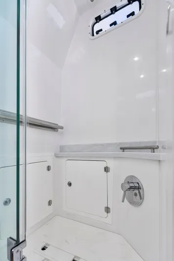 Strong III Yacht Photos Pics 2022 HCB Suenos boat interior shower with sleek white design and modern fixtures.