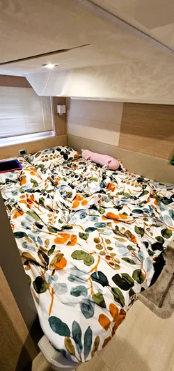  Yacht Photos Pics Cozy cabin interior of 2023 Cranchi Z35 with floral bedding and soft lighting.