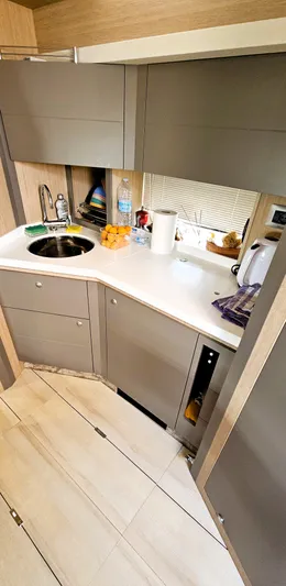  Yacht Photos Pics Modern kitchen interior of 2023 Cranchi Z35 yacht with sleek cabinetry and compact design.
