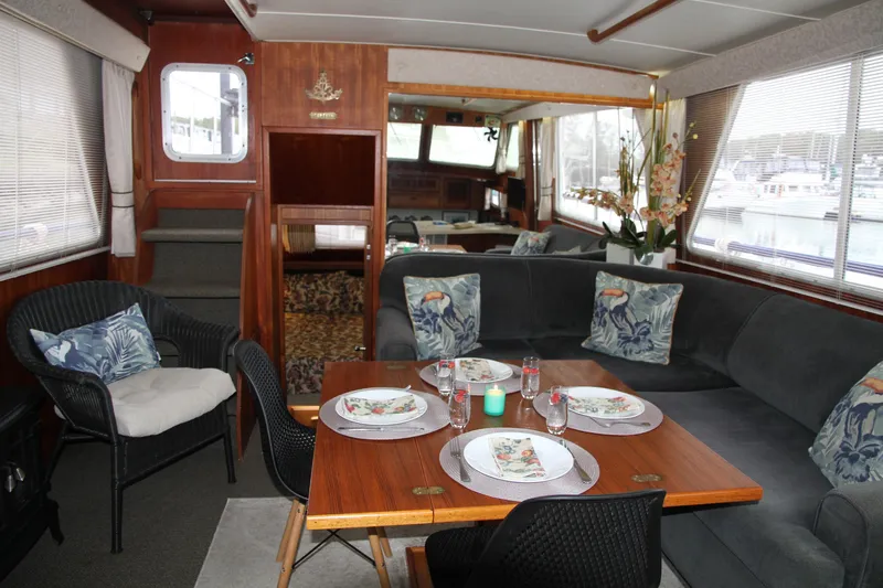 Lone Wolf Yacht Photos Pics Salon table open and set for dining for four