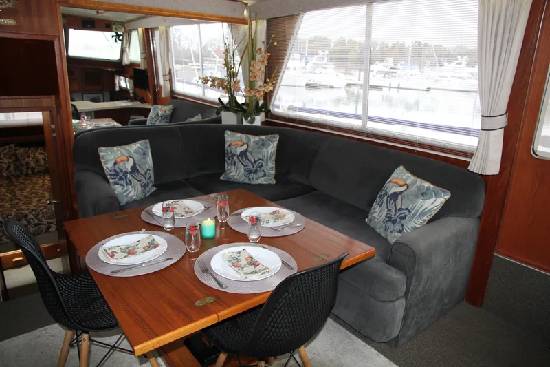 Lone Wolf Yacht Photos Pics Salon table open and set for dining for four