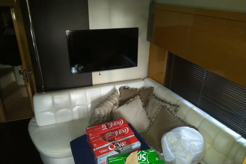 Sol Yacht Photos Pics Luxurious interior of 2010 Azimut Atlantis 54 yacht with TV and plush seating.