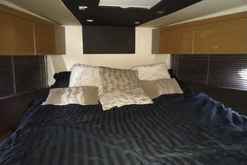 Sol Yacht Photos Pics Luxurious bedroom interior of 2010 Azimut Atlantis 54 yacht with plush bedding.