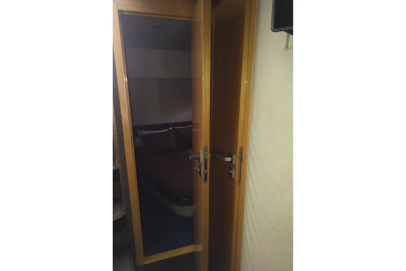 Sol Yacht Photos Pics Interior view of 2010 Azimut Atlantis 54 yacht cabin through wooden door.