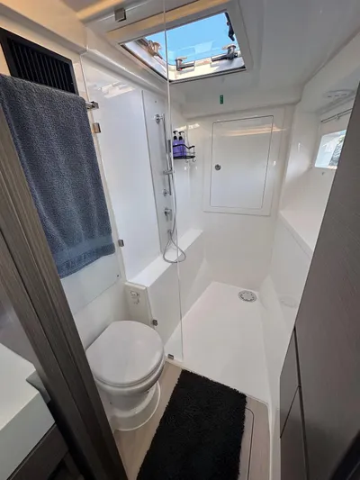Hamlet Yacht Photos Pics Modern bathroom in 2023 Leopard 46PC yacht with skylight and sleek design.