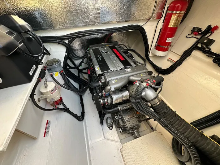 Hamlet Yacht Photos Pics Engine room of 2023 Leopard 46PC yacht, featuring a well-organized engine and fire extinguisher.
