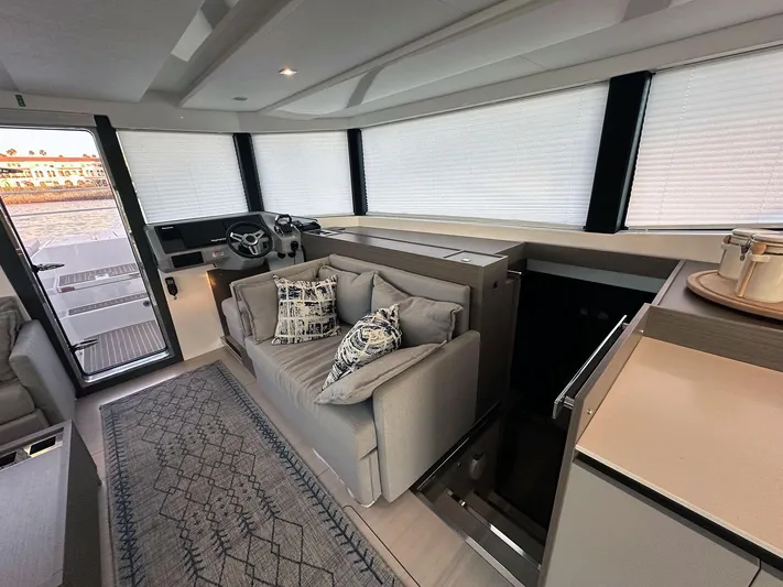 Hamlet Yacht Photos Pics Luxurious interior of 2023 Leopard 46PC yacht with modern decor and comfortable seating.