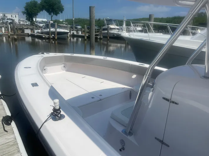  Yacht Photos Pics 2009 Venture 34 CC boat docked at marina, featuring spacious deck and sleek design.