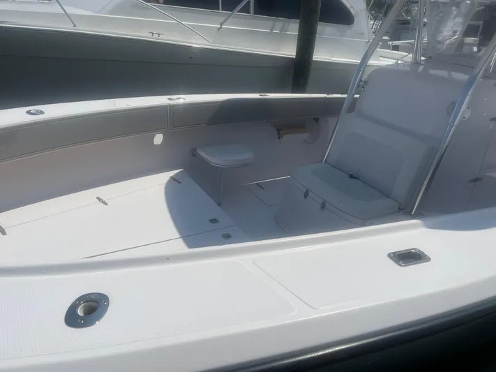  Yacht Photos Pics 2009 Venture 34 CC boat interior with seating and storage compartments.