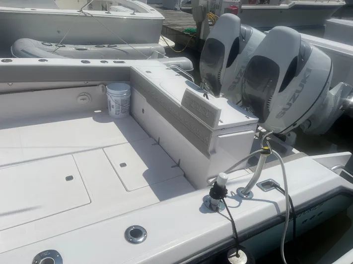  Yacht Photos Pics 2009 Venture 34 CC boat with dual Suzuki outboard engines at dock.