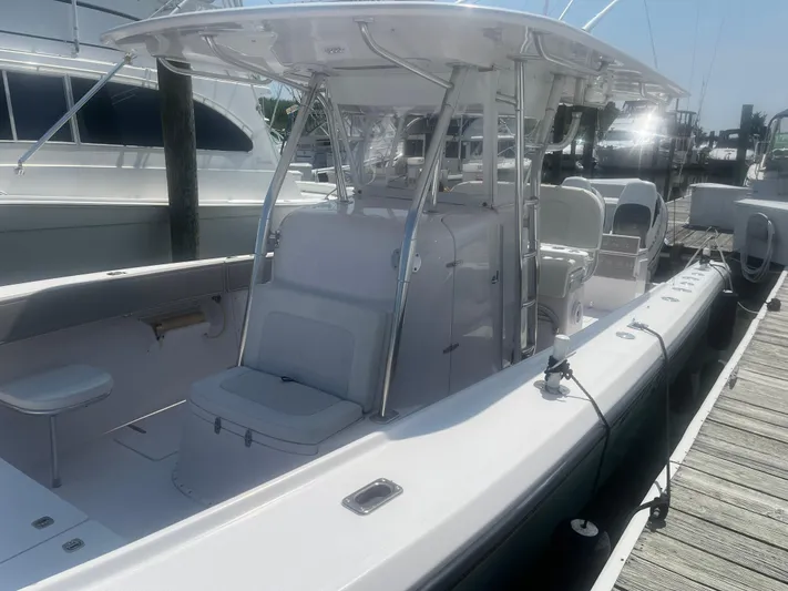  Yacht Photos Pics 2009 Venture 34 CC boat docked, featuring spacious seating and sleek design.