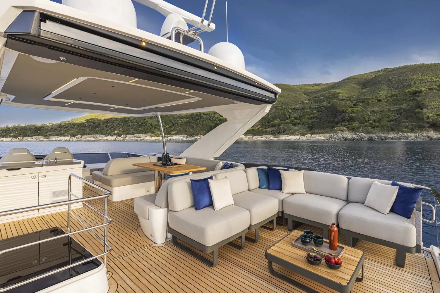 Luxurious 2025 Absolute 60 Fly yacht deck with elegant seating and scenic ocean view.