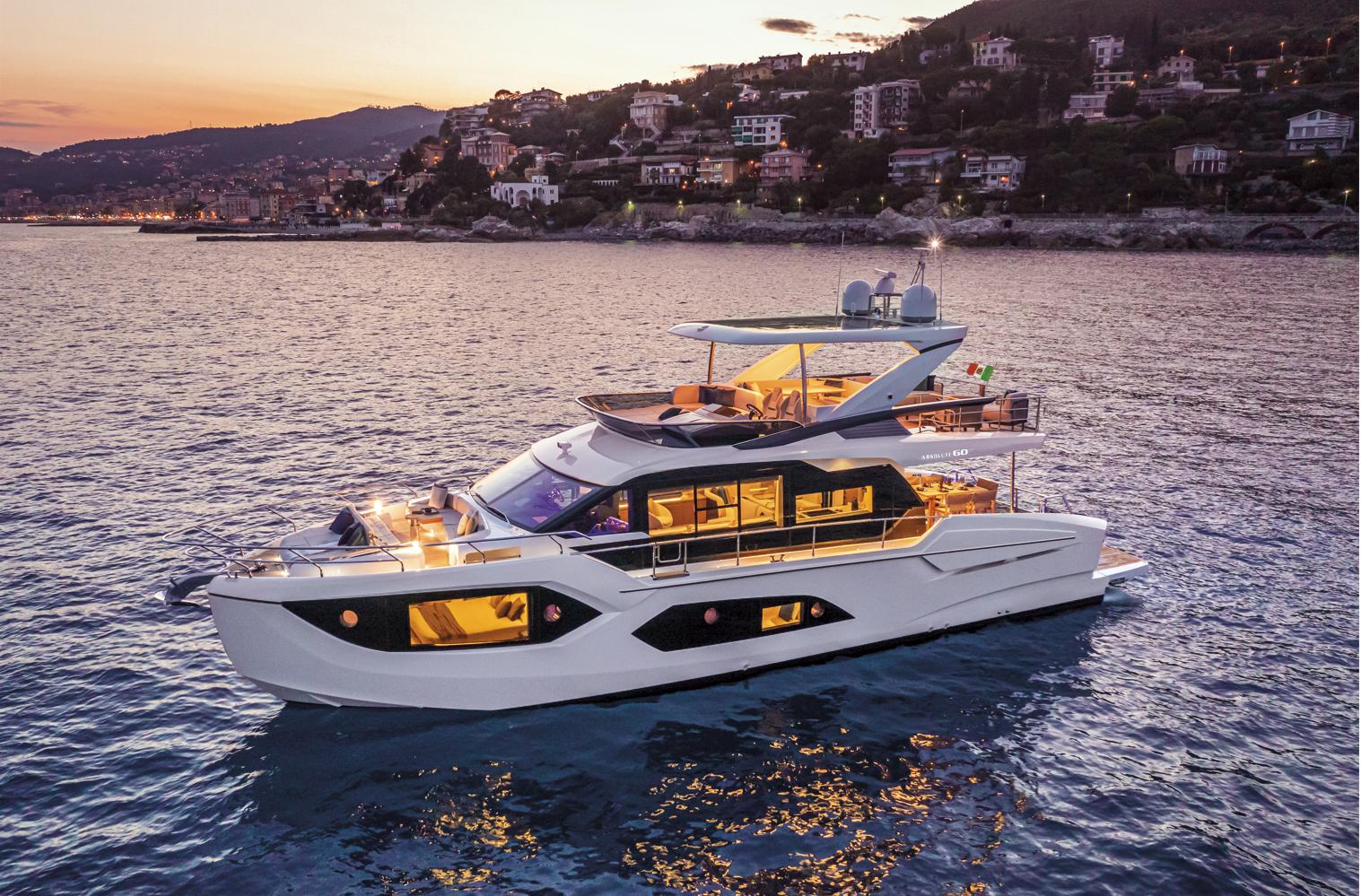 Luxurious 2025 Absolute 60 Fly Co Ownership yacht at sunset on serene waters.