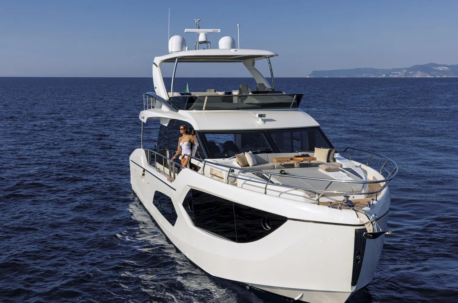 Luxury Absolute 60 Fly Co Ownership yacht cruising on open sea, 2025 model.
