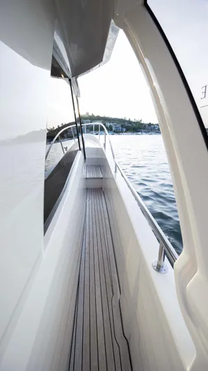 Pastiche Yacht Photos Pics 2019 Greenline Hybrid yacht deck with sleek design on calm water.