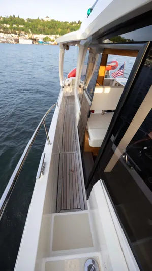Pastiche Yacht Photos Pics 2019 Greenline Hybrid boat deck with scenic water and shoreline view.