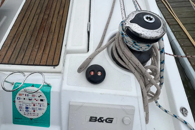  Yacht Photos Pics Deck of 2020 Beneteau Oceanis 41.1 with winch, ropes, and nautical chart.