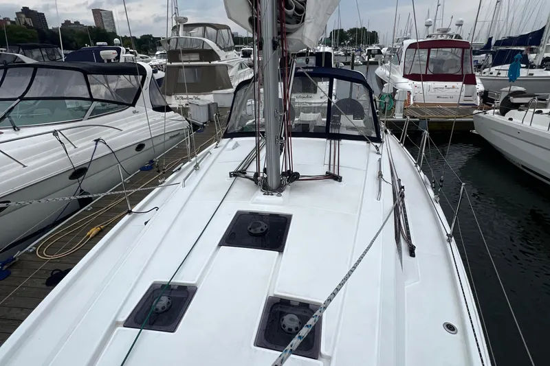  Yacht Photos Pics 2020 Beneteau Oceanis 41.1 sailboat docked in a marina, surrounded by other boats.