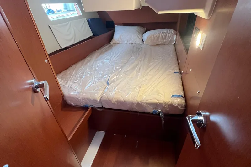  Yacht Photos Pics Cozy cabin interior of 2020 Beneteau Oceanis 41.1 yacht with double bed.