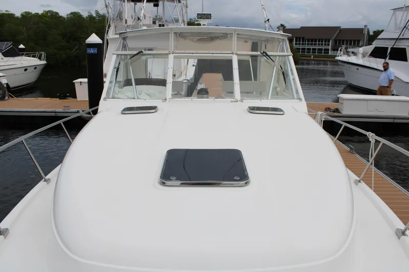 Irish Luck Yacht Photos Pics 2002 Mainship Pilot 34 boat docked at marina, front view.