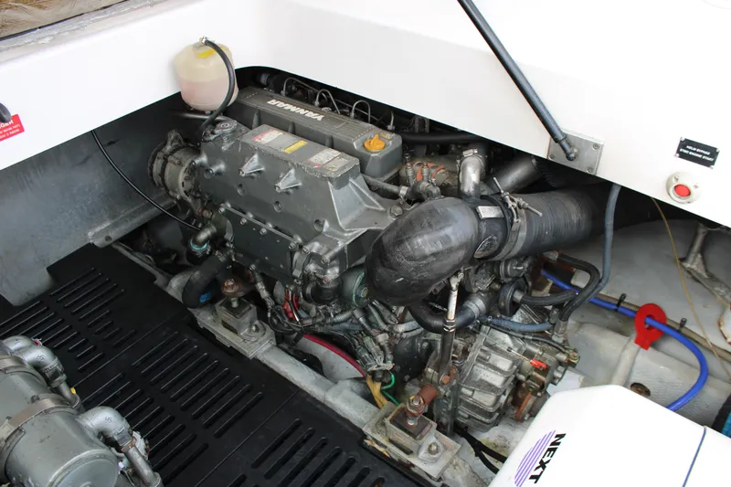 Irish Luck Yacht Photos Pics Engine compartment of a 2002 Mainship Pilot 34 boat, showcasing detailed mechanical components.