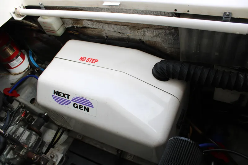 Irish Luck Yacht Photos Pics Engine compartment of 2002 Mainship Pilot 34 with Next Gen generator.