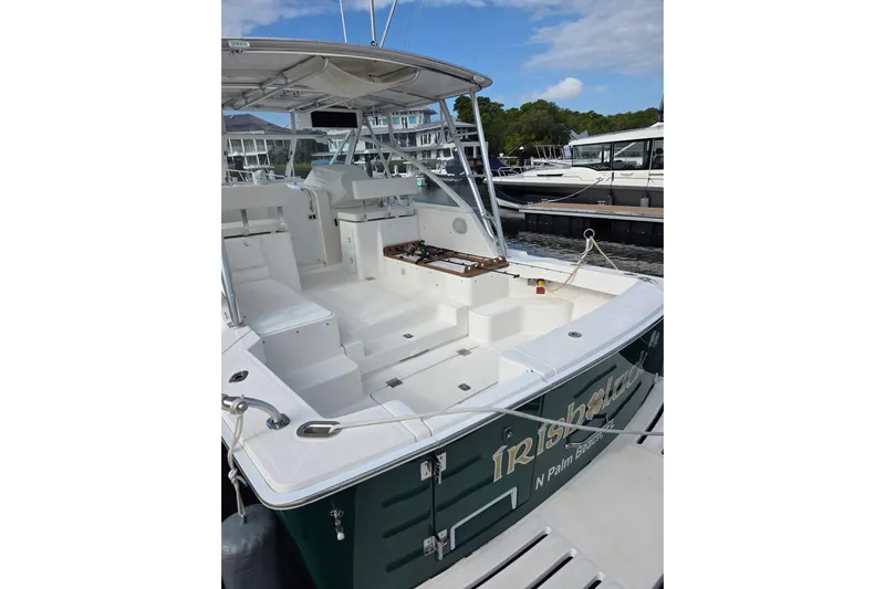Irish Luck Yacht Photos Pics 2002 Mainship Pilot 34 boat with spacious deck, docked at marina.