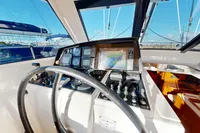 Cockpit of 2012 Amel 64 yacht with navigation instruments and steering wheel.