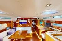 Luxurious interior of 2012 Amel 64 yacht with wooden finishes and modern amenities.