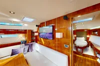 Luxurious interior of a 2012 Amel 64 yacht with elegant wood finishes and modern amenities.