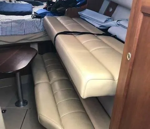 Rampage Yacht Photos Pics Interior of 2001 Rampage 30 Express boat with beige seating and compact table.