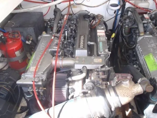 Rampage Yacht Photos Pics Engine room of a 2001 Rampage 30 Express boat with Yanmar engines and fire extinguisher.