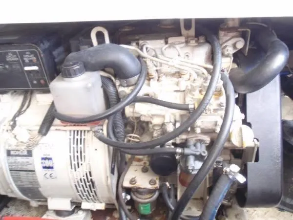 Rampage Yacht Photos Pics Engine compartment of a 2001 Rampage 30 Express boat, showing detailed mechanical components.