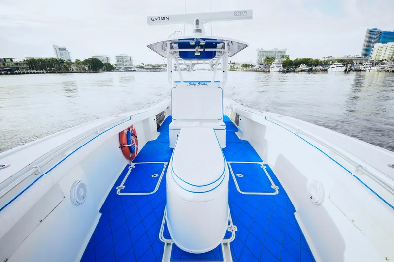  Yacht Photos Pics 2007 Yellowfin 36 Offshore boat with blue deck, docked in a marina.